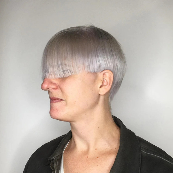 Mushroom Cut with Very Long Bangs - a woman in a side view