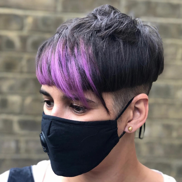 Mushroom Undercut with Edgy Violet Bangs - a woman wearing a black face mask