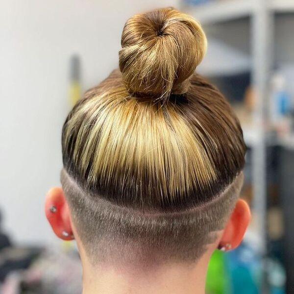 Nape Shaved Undercut and a Hair Bun - a woman in a back view