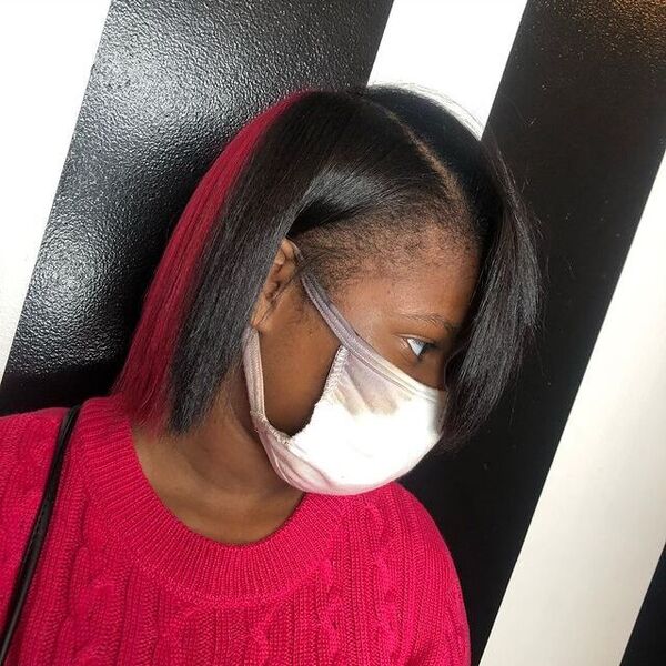 Pink Shade in Bob Cut with Silk Press - a woman wearing a face mask