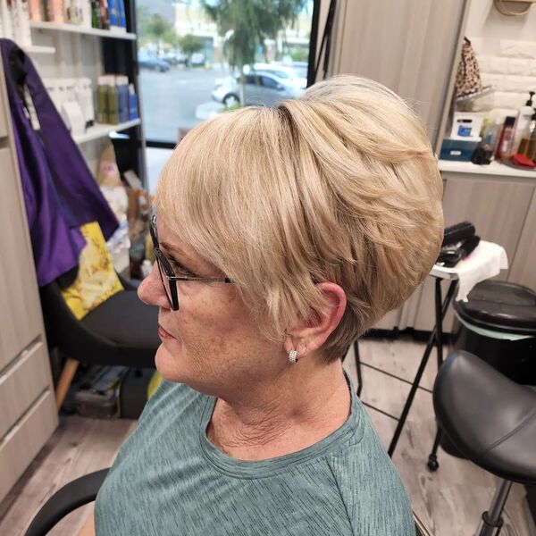 Pixie Cut for Thick Hair - a woman in a side view wearing an eyeglasses