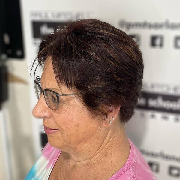 Pixie Cut with Dimensional Highlights - a woman in a side view