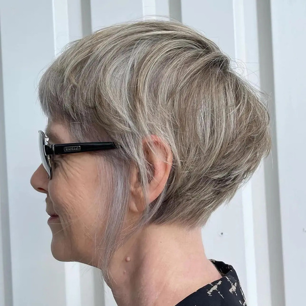 Pixie Haircuts for Older Women with Long Side Tendrils - a woman in a side view