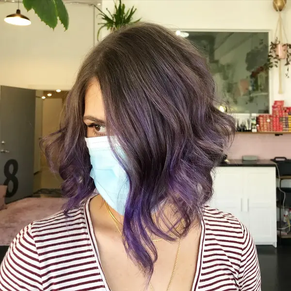 Plum and Soft Long Bob Hairstyle - a woman wearing a face mask