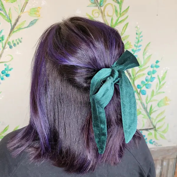 Pretty Black Purple Hair with Tied Ribbon - a woman in a back view