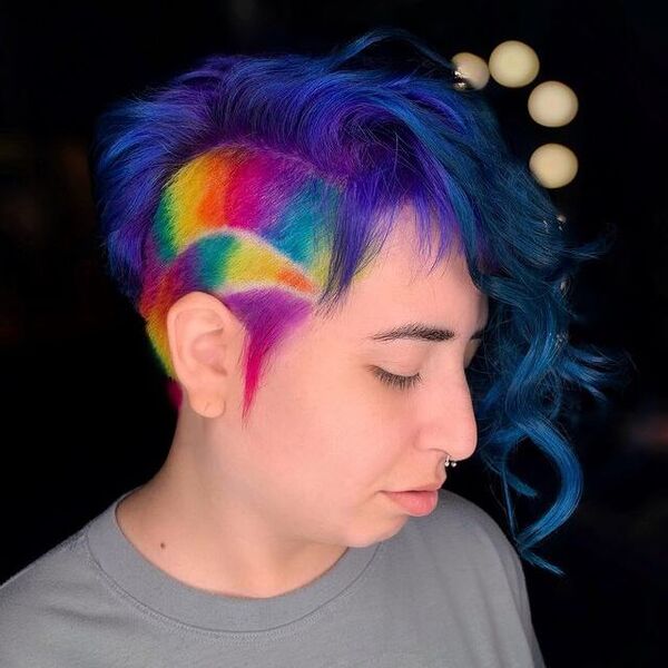 Rainbow Pop in Undercut Hairstyle - a woman wearing a gray shirt