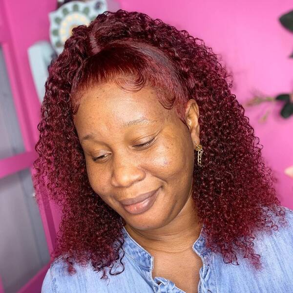 Red Bob Hairstyle and Fountain Curls - a woman wearing a denim dress