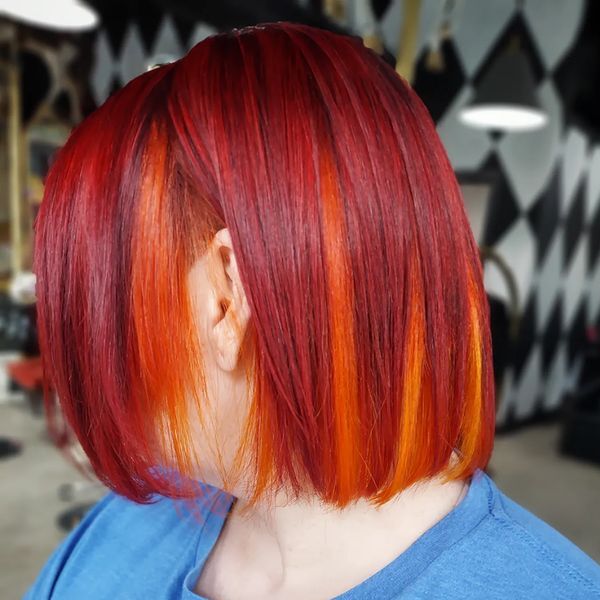 Red Hair with Orange Peek-a-Boo - a woman wearing a blue shirt