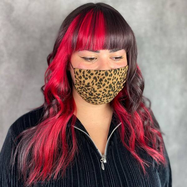 Red and Dark Brown Tint and Bangs - a woman wearing a face mask