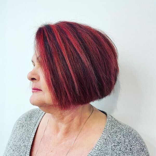 Ruby Red and Triangular Cut for Older Women - a woman in a side view