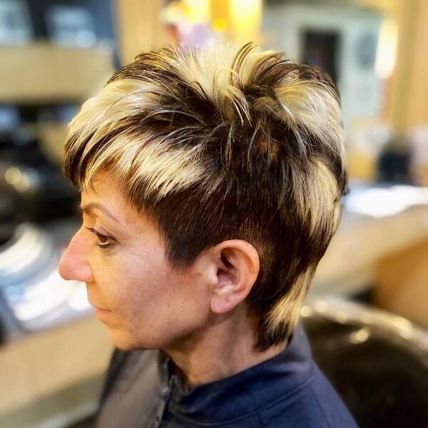 Semi Pixie Mullet Cut with Black and Blonde Tones - a woman in a side view