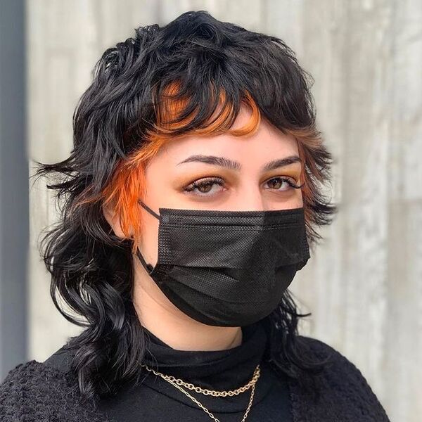 Shaglet with Orange Peek-a-Boo - a woman wearing a black face mask