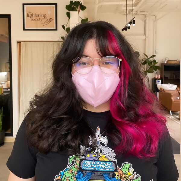 Soft Curtain Bangs with Magenta Color Block - a woman wearing a pink face mask