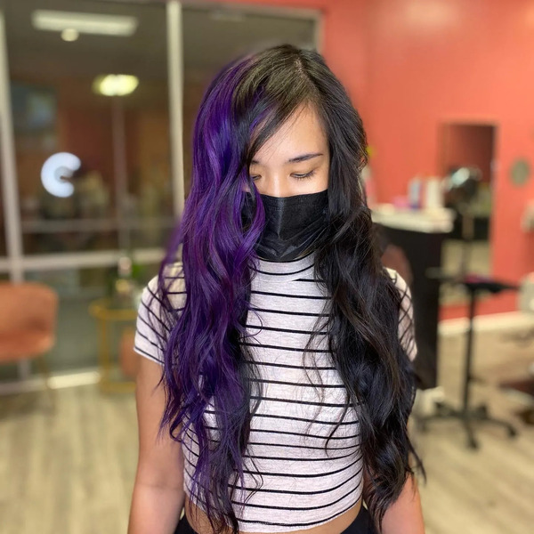 Split Dye for Long and Wavy Hair - a woman wearing a black face mask