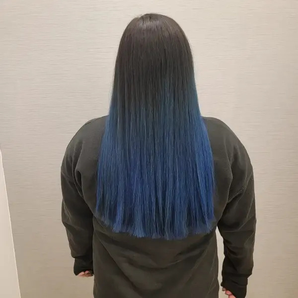 Straight and Blue Ombre Hair - a woman in a back view