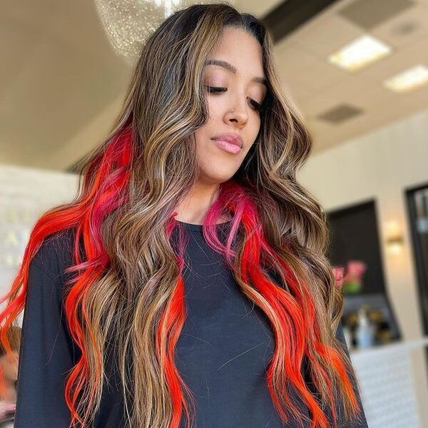 Stunning Red-Orange and Pink Peek-a-Boo - a woman wearing a black long sleeve