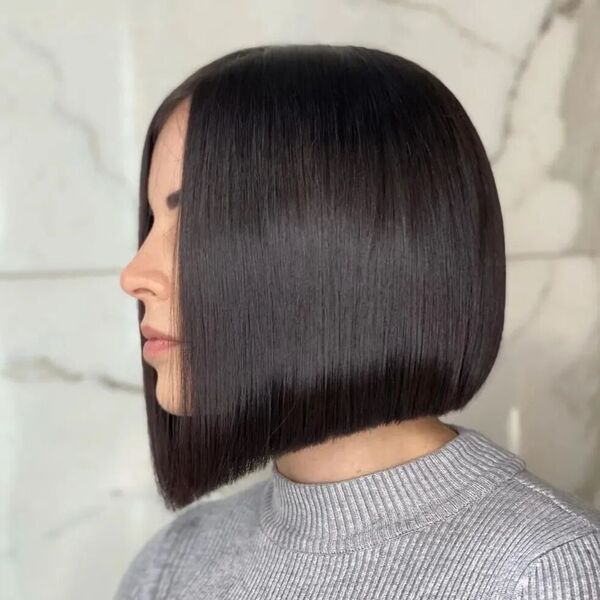 Stunning Black and Soft Bob Cut  - a woman in a side view