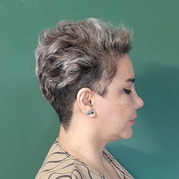 Textured and Curls with Undercut - a woman in a side view