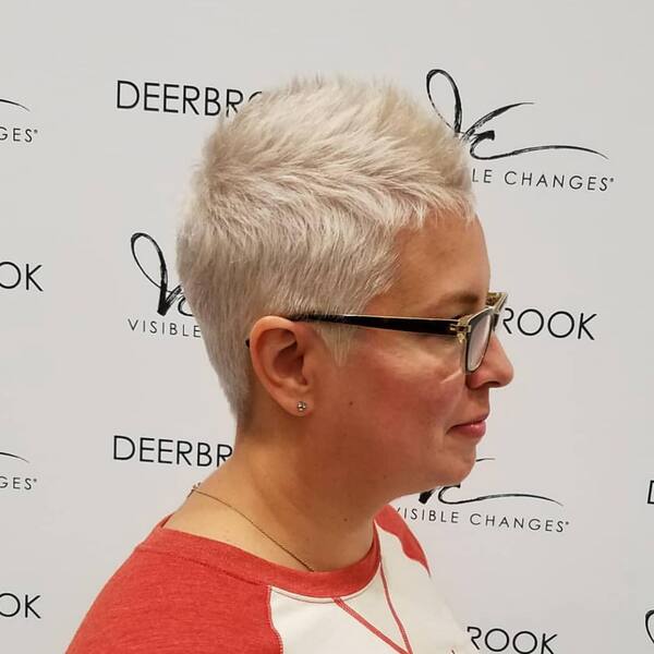 The Spikey Pixie Haircut - a woman in a side view wearing an eyeglasses