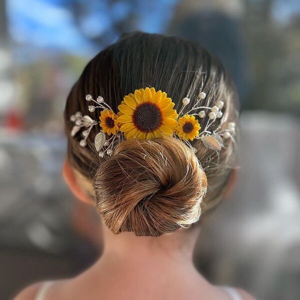 Twisted Low Bun with Cute Sunflower - a girl in back view