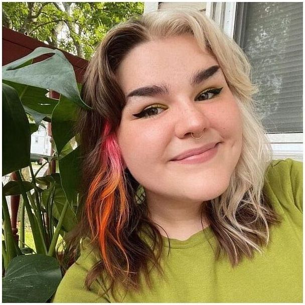 Two-Toned and Phoenix Tail Vibes - a woman wearing green shirt