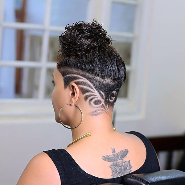 Undercut with Shaved Leaflet Vines - a woman wearing a black sleeveless