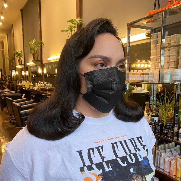 Vintage Haircut and Style- a woman wearing a face mask