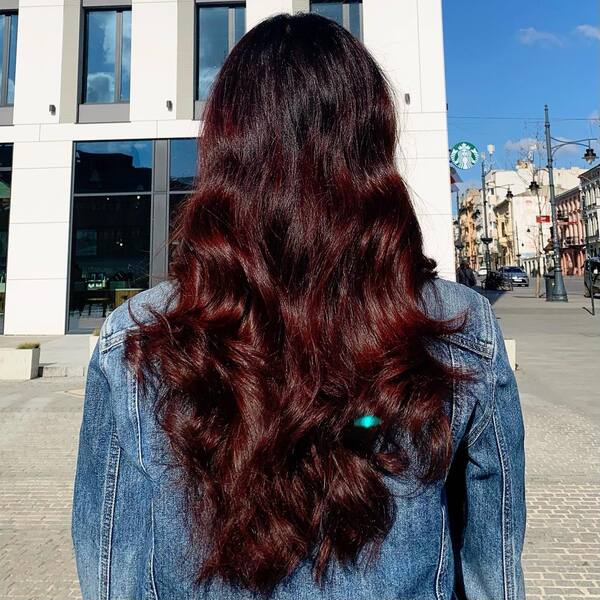 Wavy Burgundy Hair - a woman in a back view