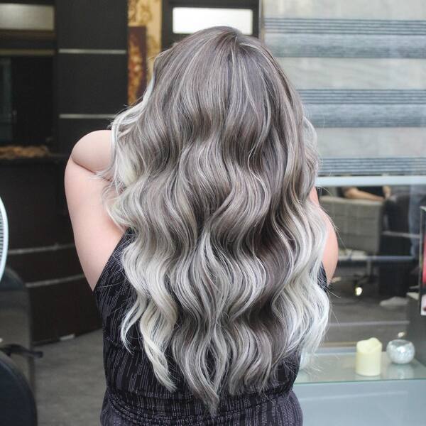 Wavy Hair and Platinum Highlights - a woman in a back view