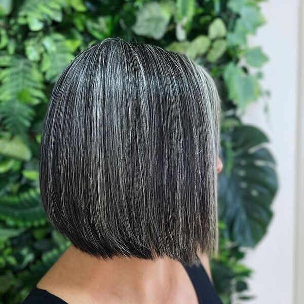 Silver Strips Tint in Blunt Bob Haircut - a woman in a side view