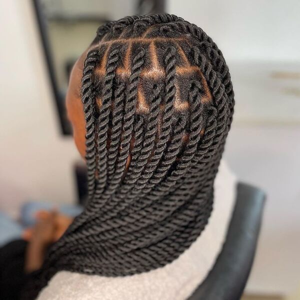 Box Twisted Braids - a woman wearing brown shirt