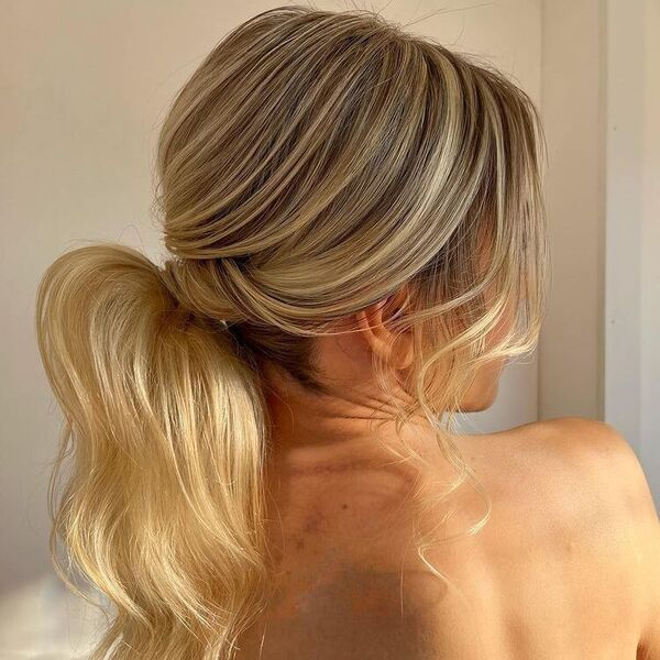 Classy Blonde Pony with Layer Side Bangs - a woman wearing backless