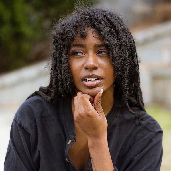 Classy Long Dreadlocks - a woman wearing black polo