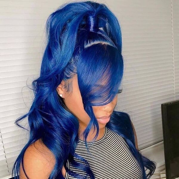 Curl Bangs in Vibrant Blue Ponytail - a woman wearing stripe tank top