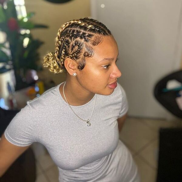 Designed Cornrow Braid buns - a woman wearing gray dress