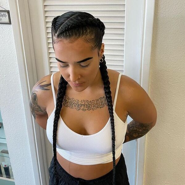 Double Long Feed-in Braids - a woman wearing white bralette