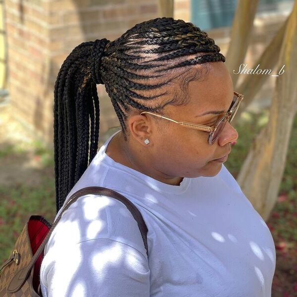 Feed-in Braids Ponytail - a woman wearing white shirt