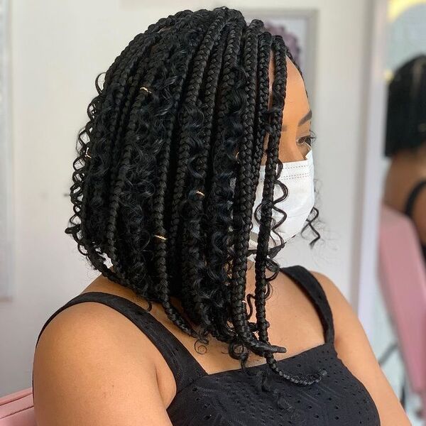 Glamorous Asymmetrical Braided Bob - a woman wearing black islet top