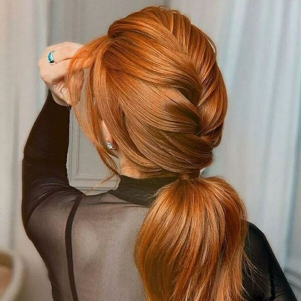 Loose Braid Ponytail with Curtain Fringe - a woman wearing black mesh top