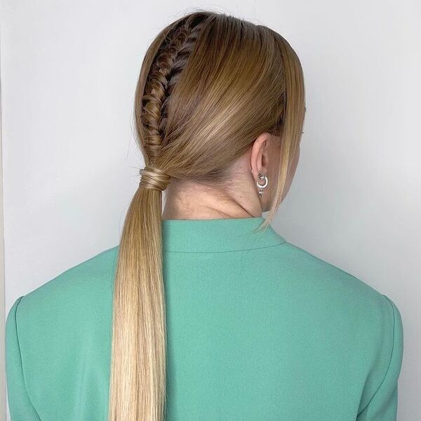 Low Ponytail with Twist Braids & Fine Bangs - a woman wearing sage green coat