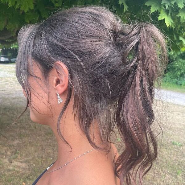 Messy Bangs and Ponytail - a woman wearing silver accessories