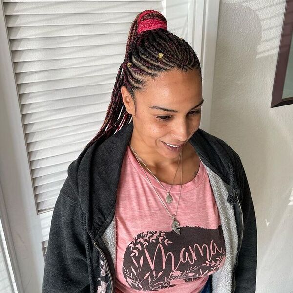 Pink Tints Fulani Braids Ponytail - a woman wearing black jacket with pink inner shirt