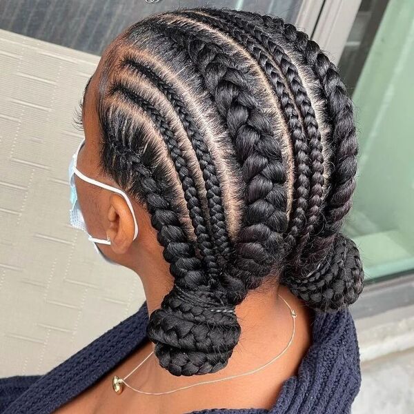 Sleek Dutch Braids Low Buns - a woman wearing navy blue crochet top