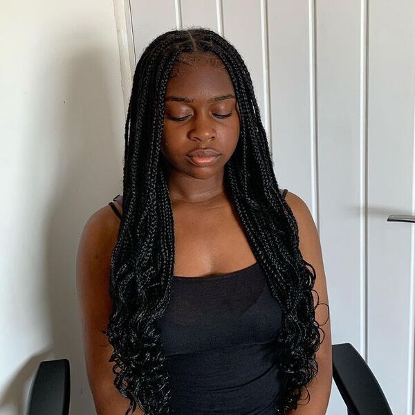 Small Knotless Braids Curly Ends - a woman wearing black tank top