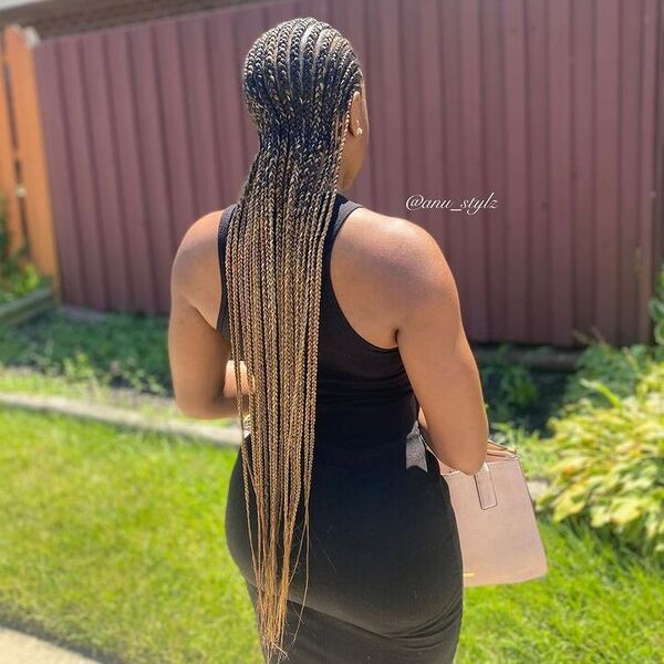 Straight Back Cornrow Braids - a woman wearing black bodycon dress