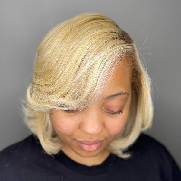 Swept Side Blonde Bob - a woman wearing black shirt