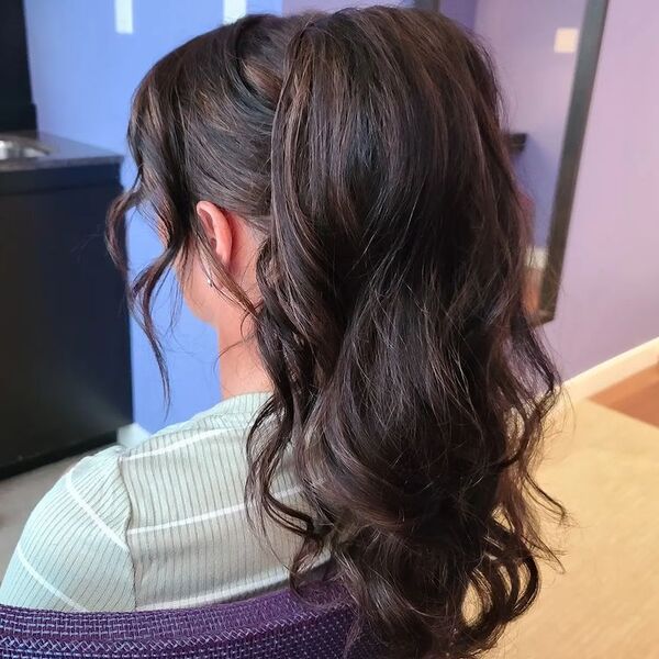 Voluminous Ponytail with Wavy Bangs - a woman wearing light green stripe top