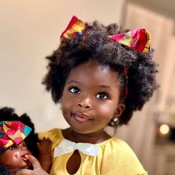 Beautiful Coiled Shag Bob - a girl is wearing yellow top