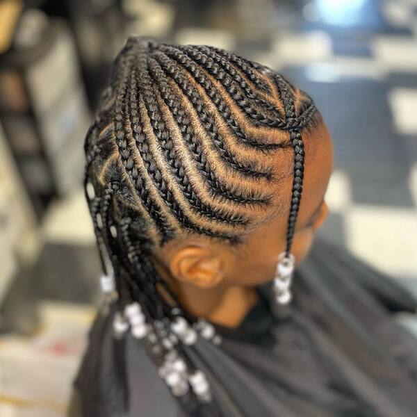 Blended Knotless and Heart Braids - a girls is wearing black cape