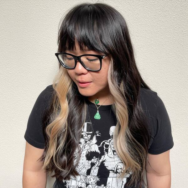 A woman wearing punk shirt with glasses